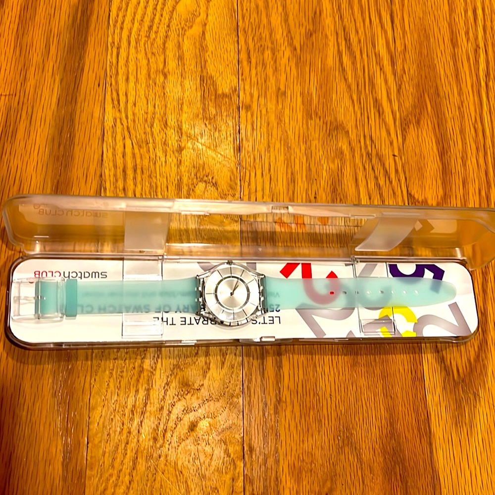 Baby blue gel band swatch with silver face. New with tags. Needs new battery